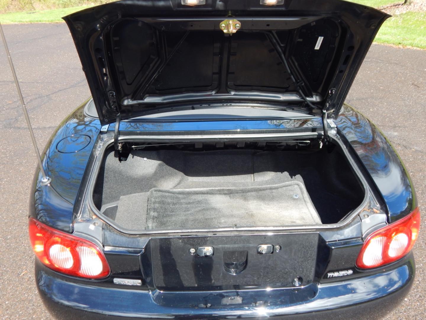 2002 Black /Black Cloth Mazda MX-5 Miata base (JM1NB353920) with an 1.8 liter 4 cylinder engine, 5 speed manual transmission, located at 6528 Lower York Road, New Hope, PA, 18938, (215) 862-9555, 40.358707, -74.977882 - Here for sale is a very fun 2002 Mazda MX-5 Miata. Under the hood is a strong running 1.8 liter 4 cylinder which puts power to the rear wheels via a solid shifting 5 speed manual transmission. Features include; Black cloth interior, wood grain trim, cold AC, power windows, AM/FM/CD, heated rear wi - Photo#18